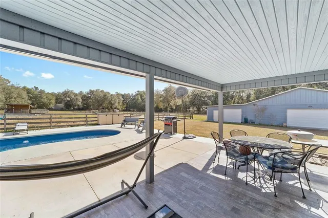 a view of a swimming pool with lounge chair