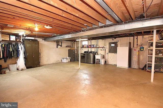 a view of empty room with wooden walls