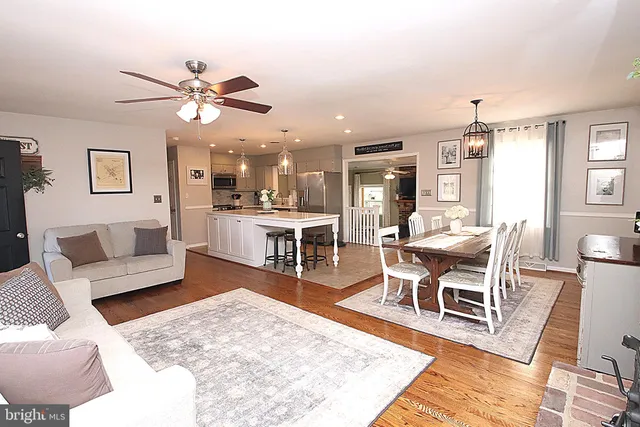 a living room with a couch and dining table