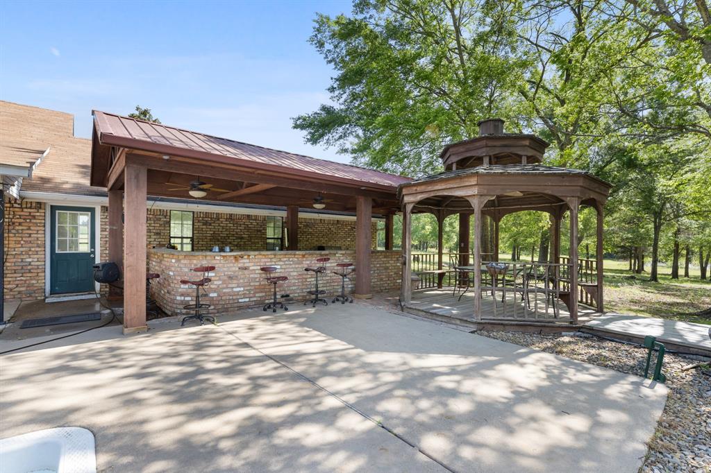 321 Vz County Road 2602 Wills Point, TX 75169 - Photo 32 of 39 View of community featuring a gazebo, outdoor dry bar, and a patio
