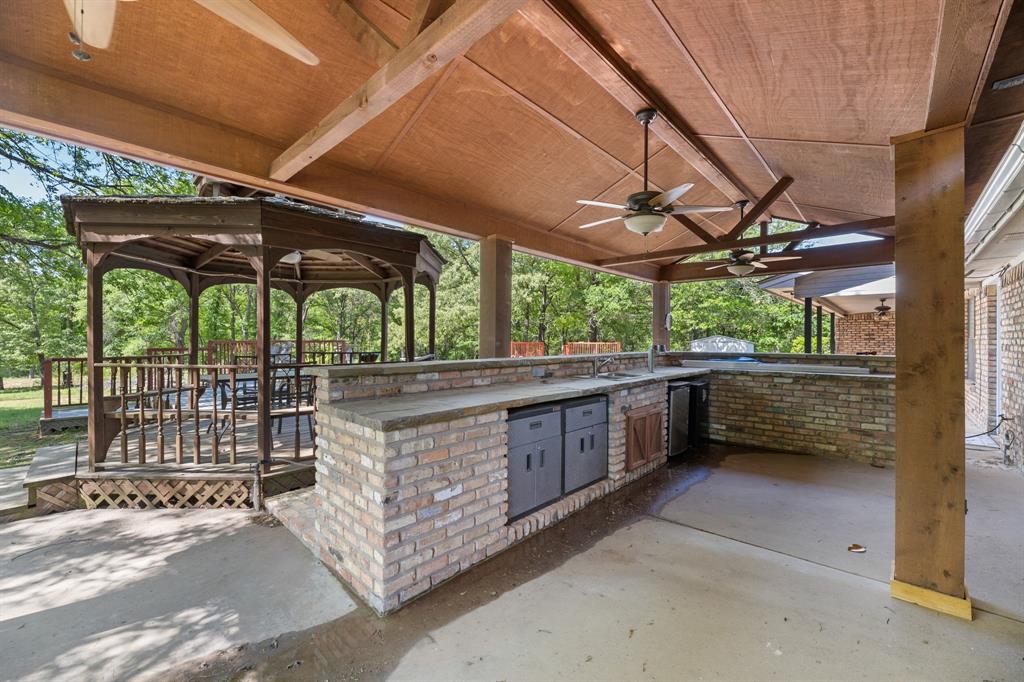321 Vz County Road 2602 Wills Point, TX 75169 - Photo 33 of 39 View of patio / terrace with a ceiling fan, area for grilling, a sink, and a gazebo