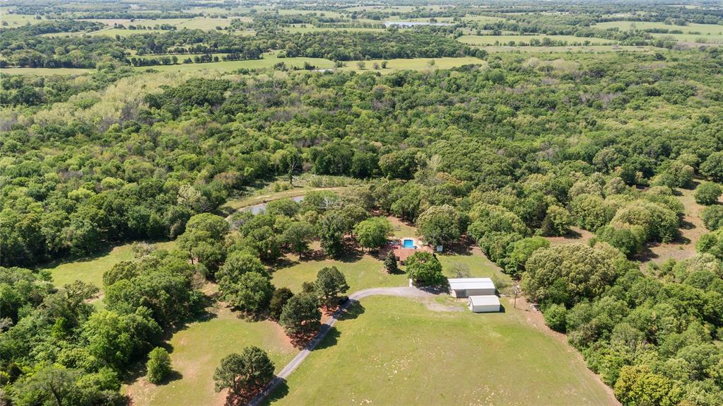 321 Vz County Road 2602 Wills Point, TX 75169 - Photo 39 of 39 Drone / aerial view with a wooded view