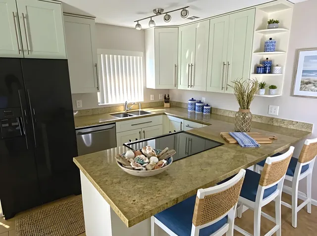 a kitchen with a table chairs and wooden floor