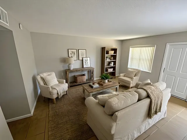 a living room with furniture or couch and a window