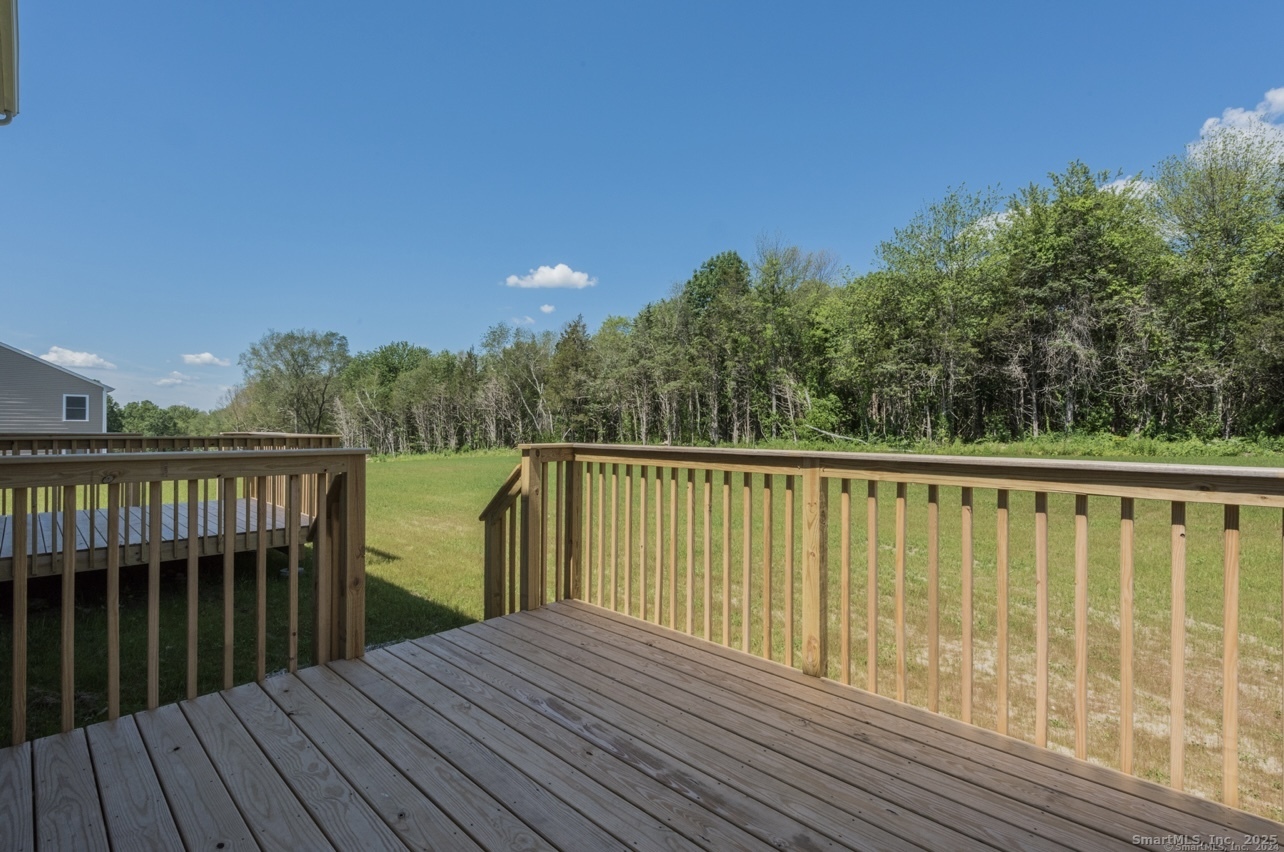 13 Nature Avenue, Unit A Colchester, CT 06415 - Photo 13 of 34 a view of balcony with wooden floor and fence