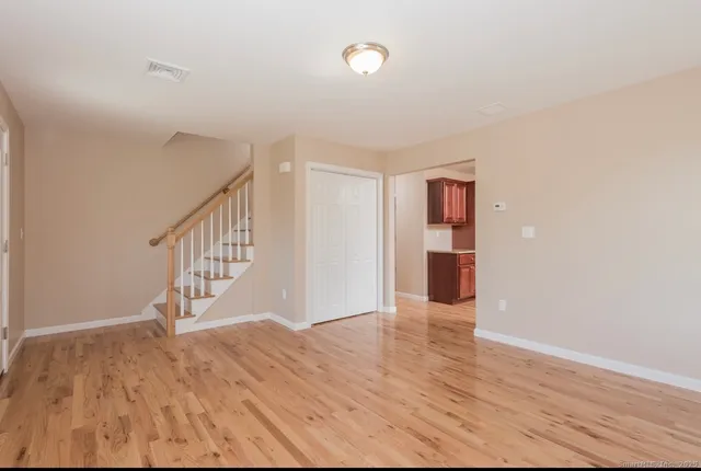 a view of entryway with wooden floor
