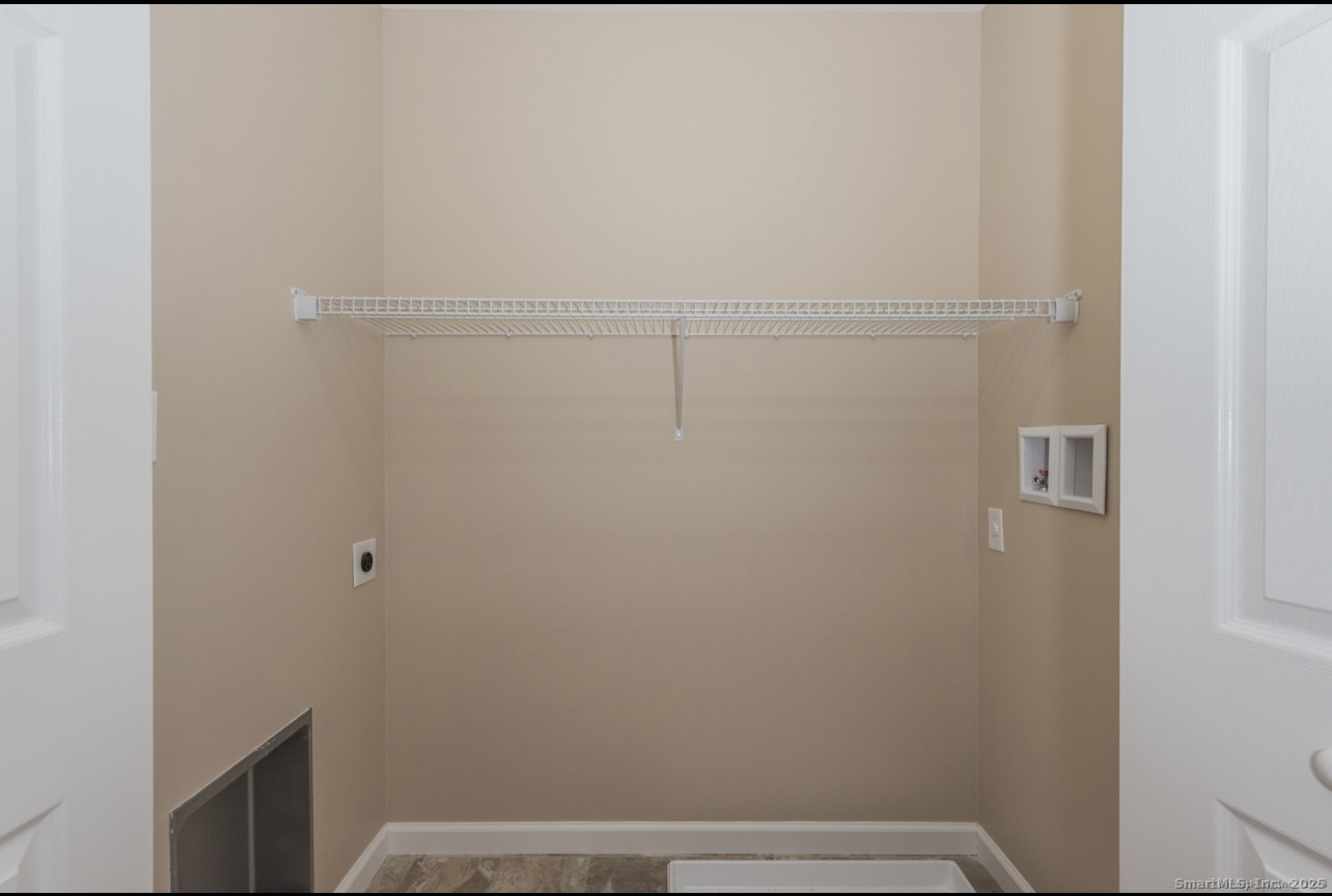 13 Nature Avenue, Unit A Colchester, CT 06415 - Photo 23 of 34 a view of small space with racks on the wall