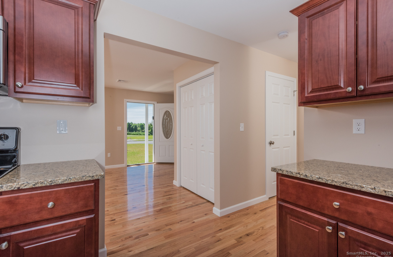 13 Nature Avenue, Unit A Colchester, CT 06415 - Photo 4 of 34 a view of a kitchen cabinets and wooden floor
