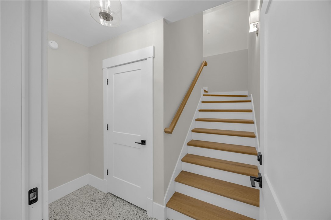 1230 Melton Road, Unit 216 West Union, SC 29696 - Photo 34 of 49 Clean lines and light-toned walls define this inviting entryway with wood-accented stairs.