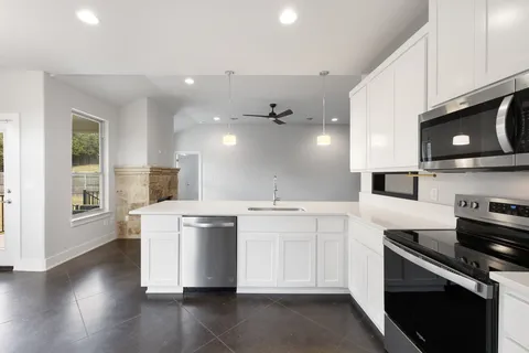 a kitchen with a stove and a microwave