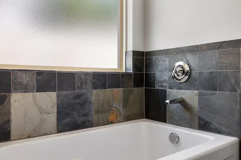 a bathroom with a bathtub