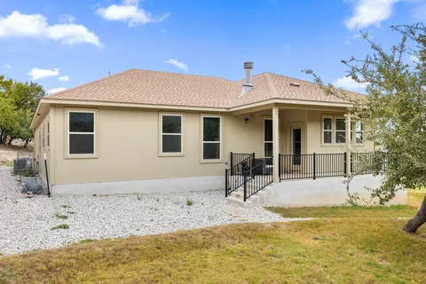 a tree in the middle of a yard