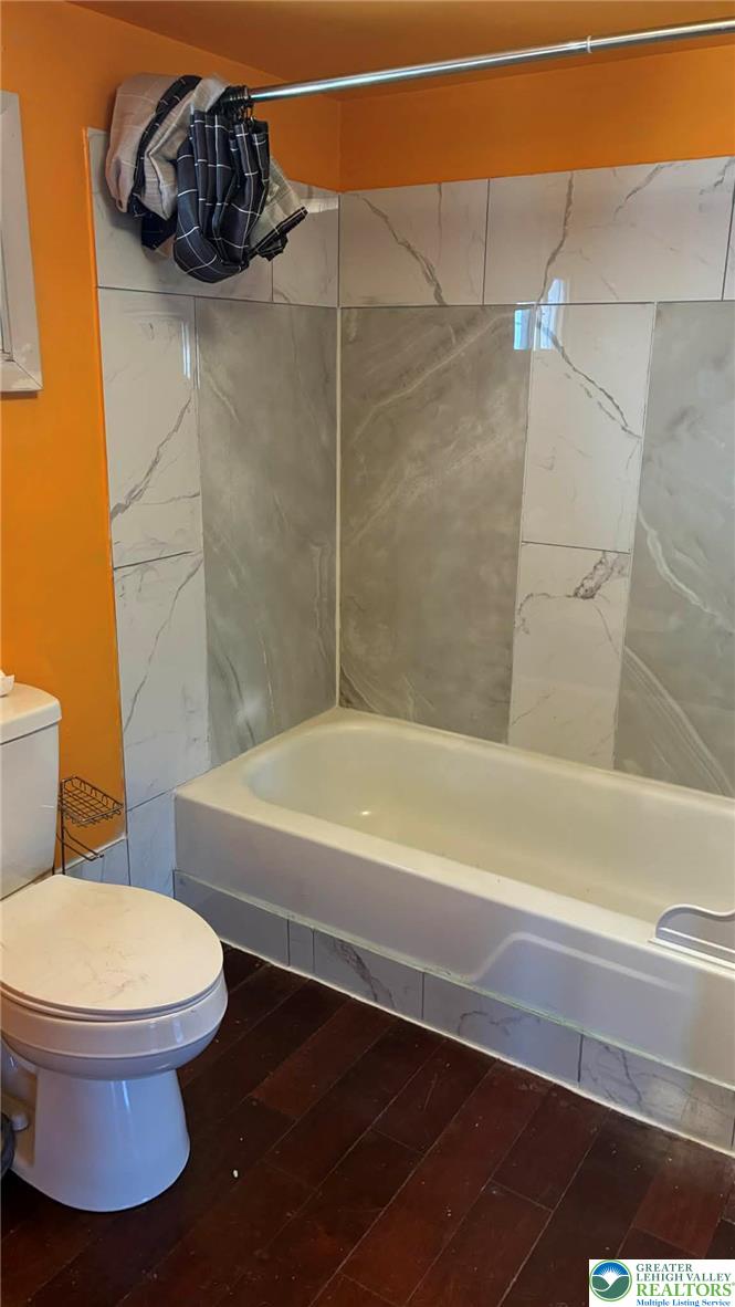 140 South Front Street, Unit REAR Coplay, PA 18037 - Photo 11 of 19 a bathroom with a toilet and a bath tub