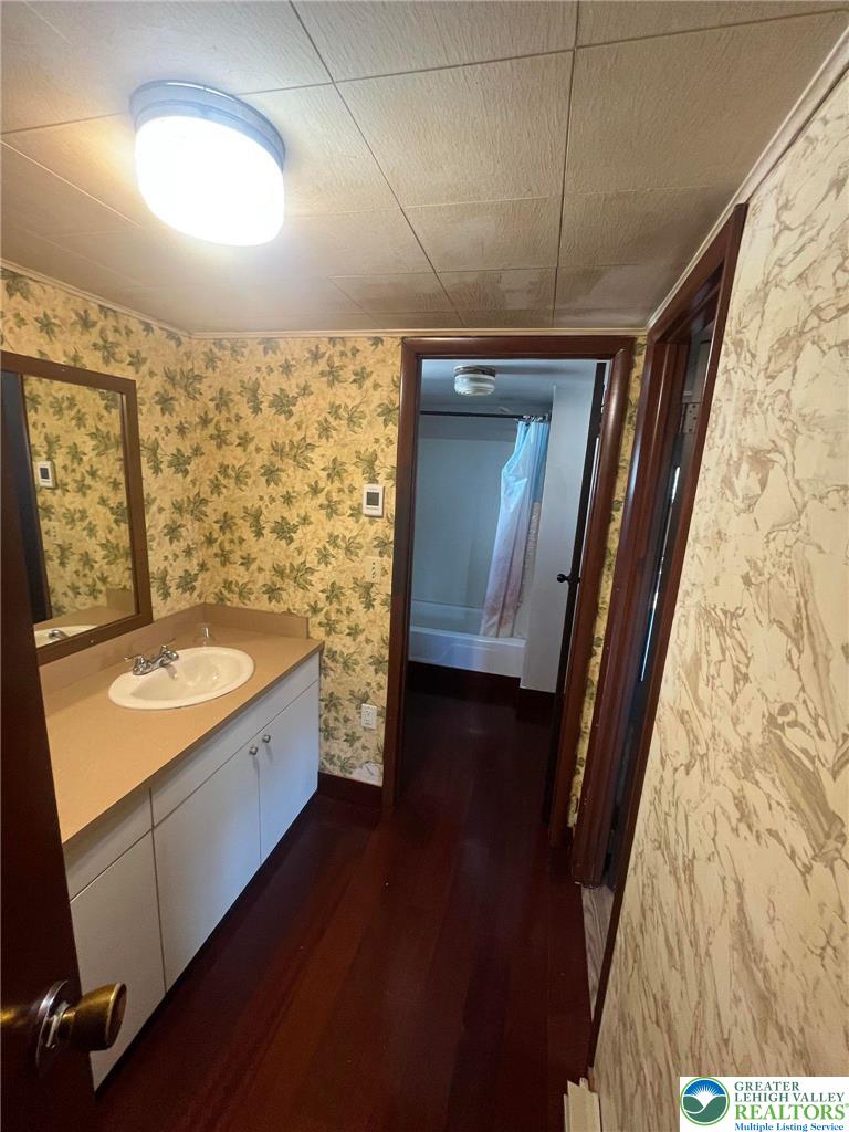 140 South Front Street, Unit REAR Coplay, PA 18037 - Photo 10 of 19 a bathroom with a granite countertop sink toilet and shower