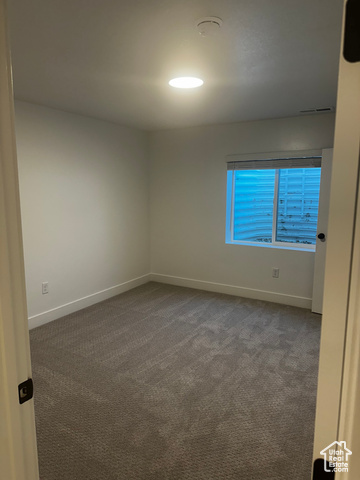 22 South Starlight Lane Mapleton, UT 84664 - Photo 17 of 17 Empty room with carpet floors and a smoke detector