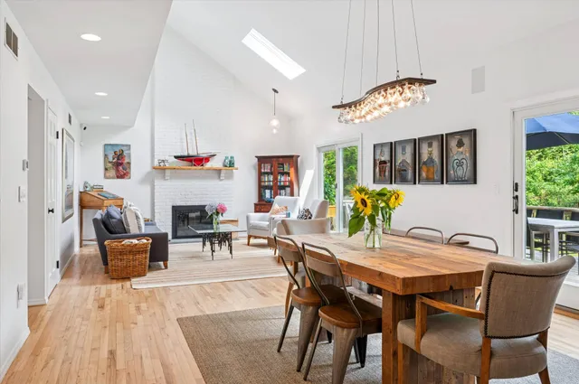 a dining room with furniture and chandelier