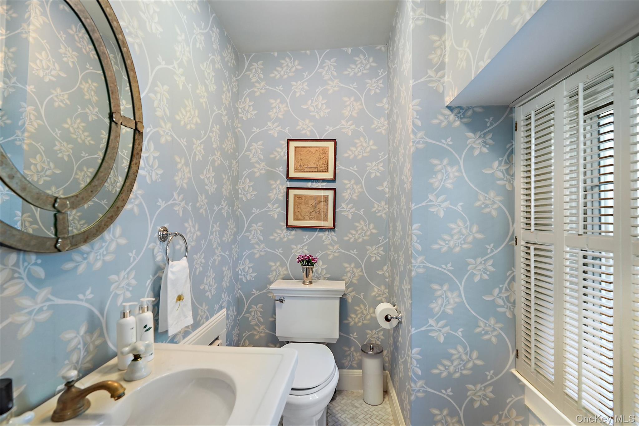 49 Moore Road Bronxville, NY 10708 - Photo 15 of 46 a bathroom with a toilet sink and mirror