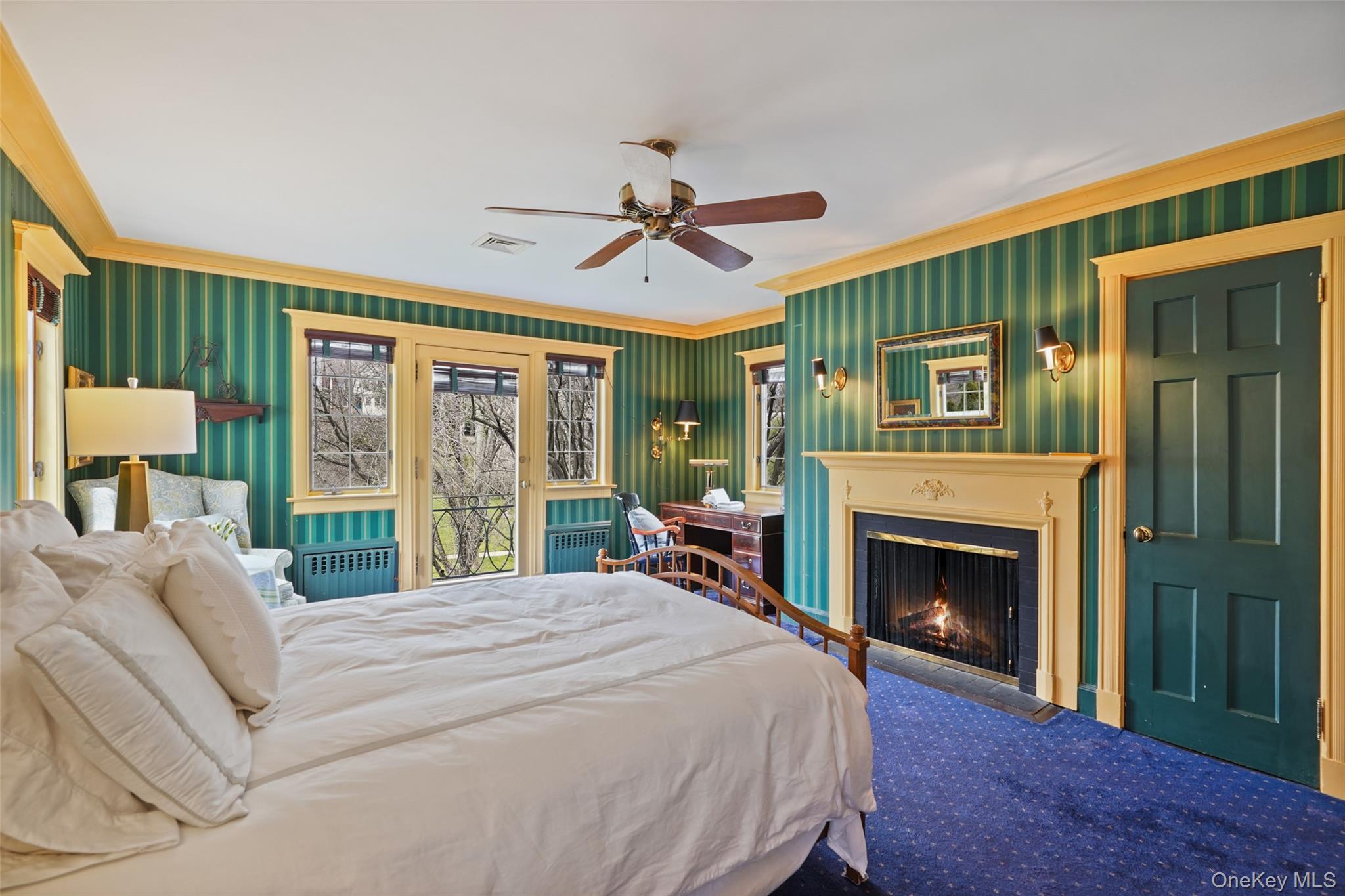 49 Moore Road Bronxville, NY 10708 - Photo 22 of 46 a bed sitting in a bedroom next to a balcony