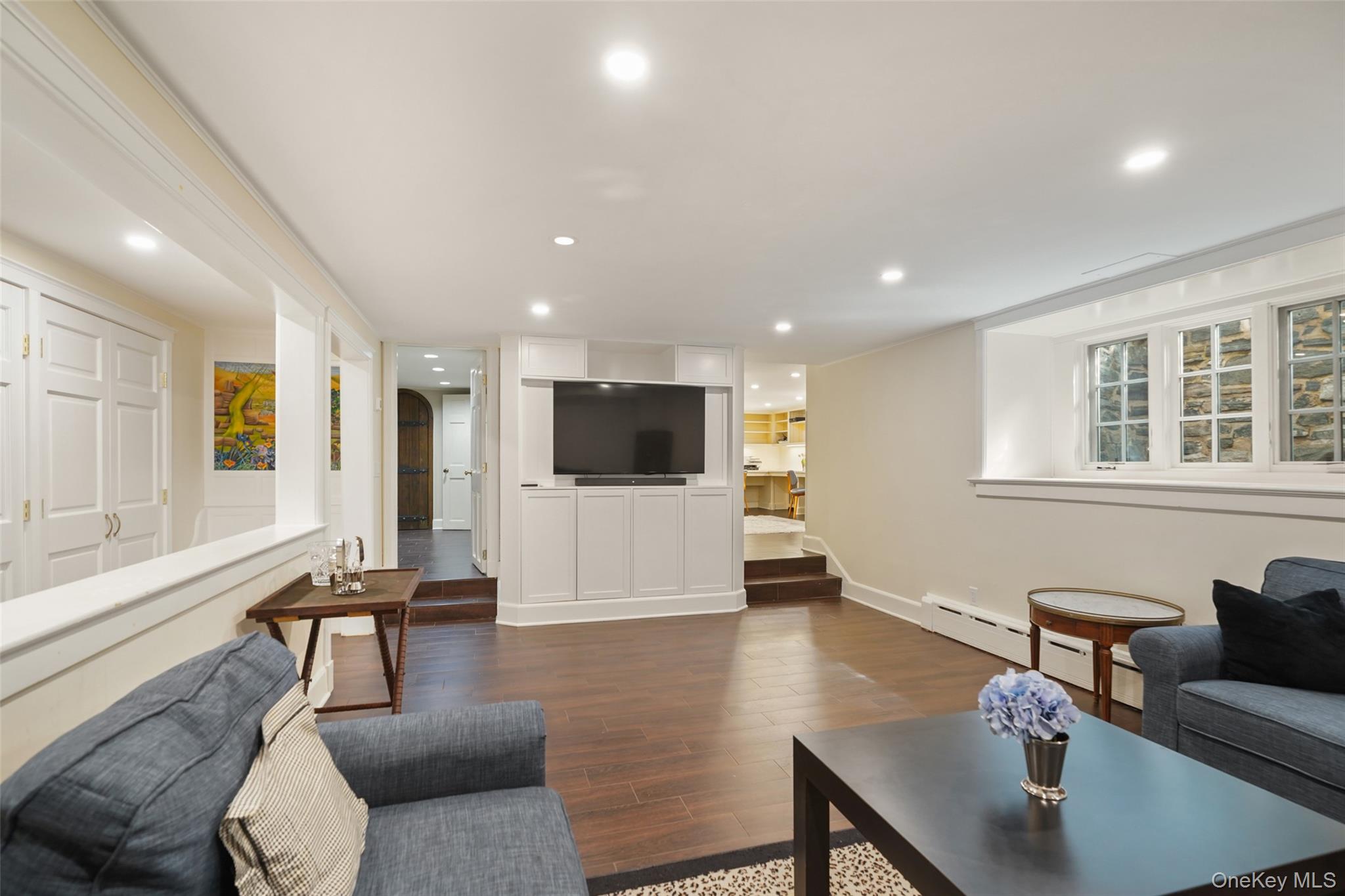 49 Moore Road Bronxville, NY 10708 - Photo 30 of 46 a living room with furniture and a flat screen tv