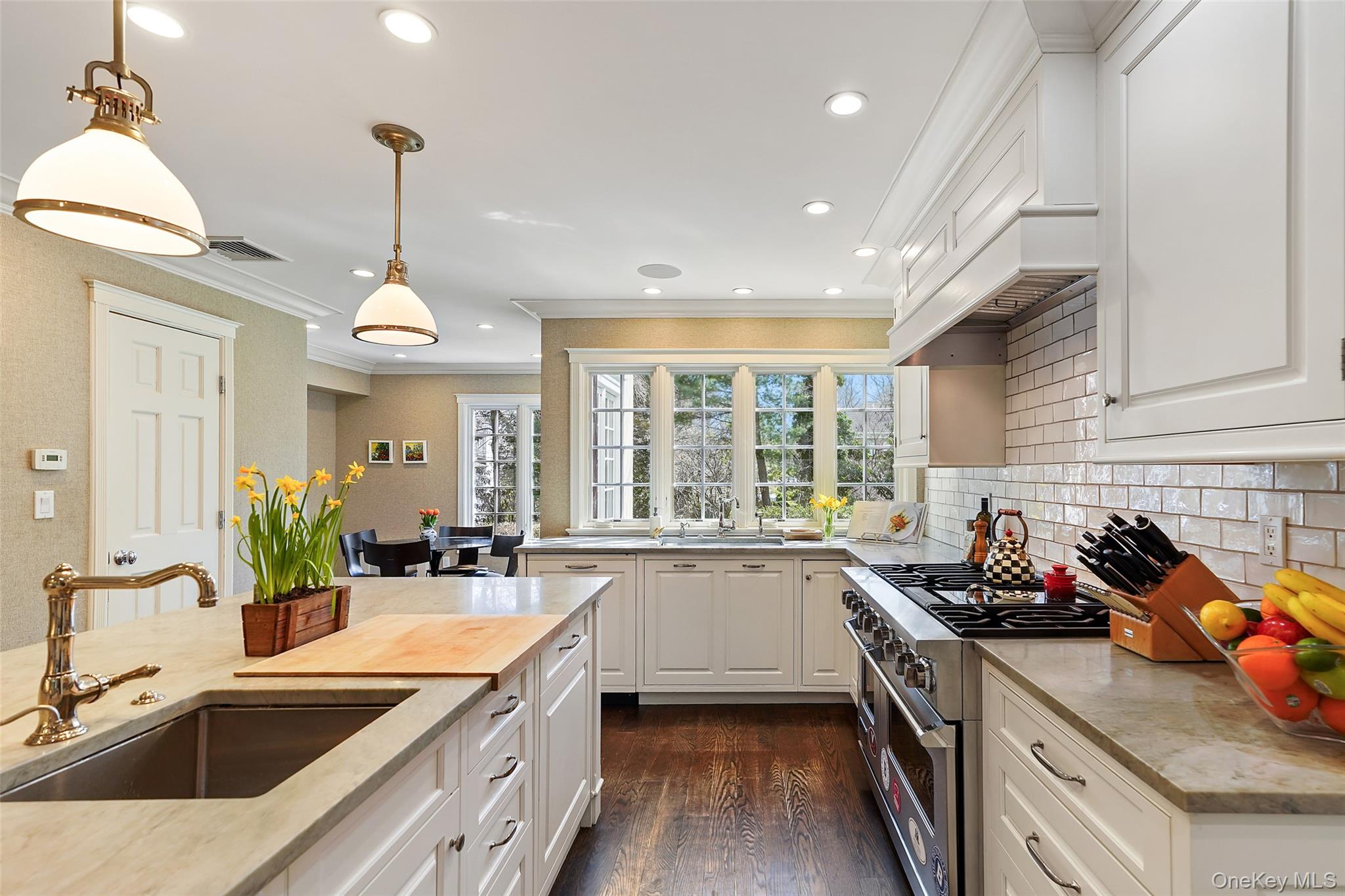49 Moore Road Bronxville, NY 10708 - Photo 7 of 46 a kitchen that has a sink stove and cabinets