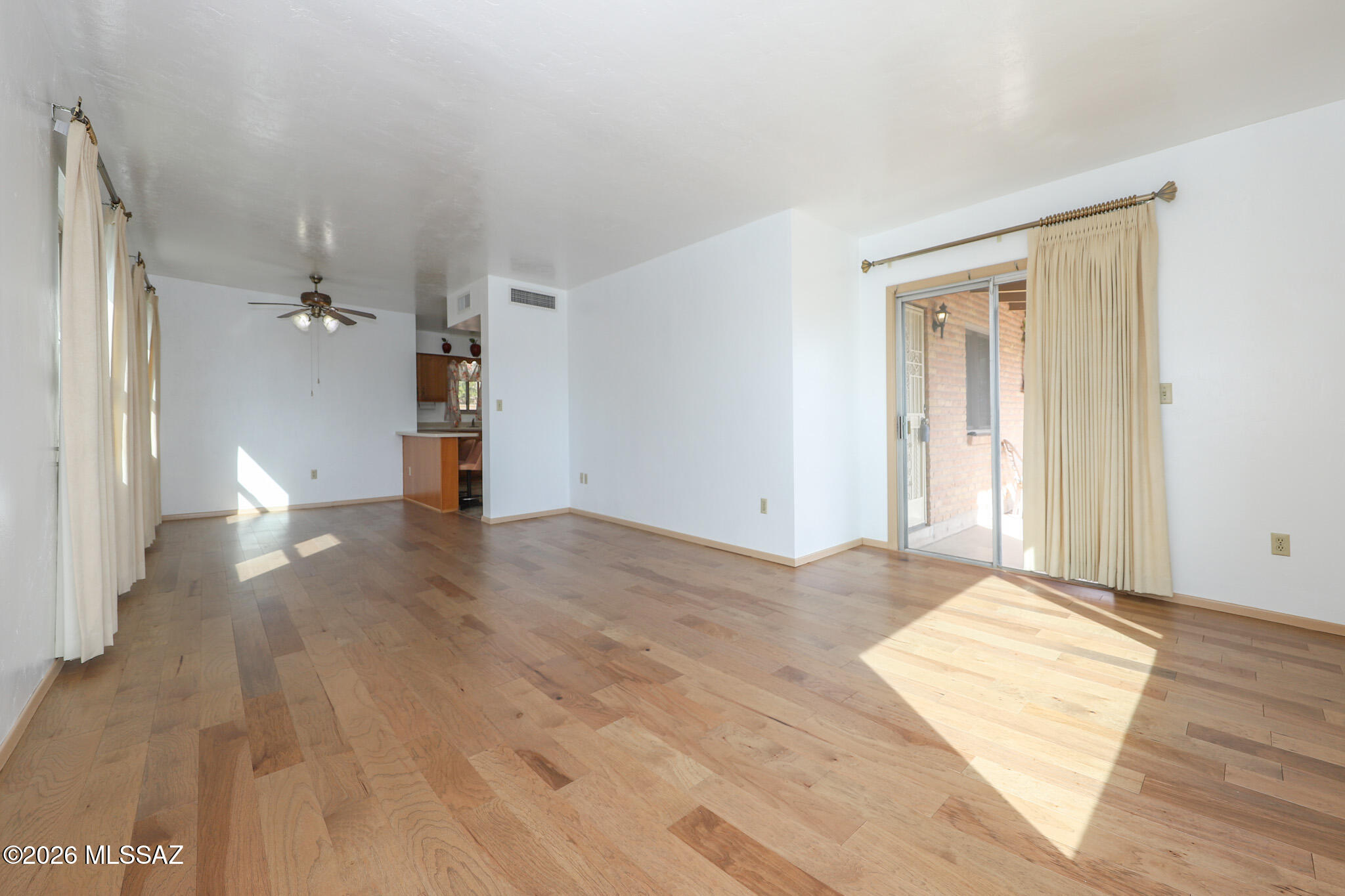 37 North Silverbell Road Tucson, AZ 85745 - Photo 15 of 31 a view of a big room with wooden floor and windows
