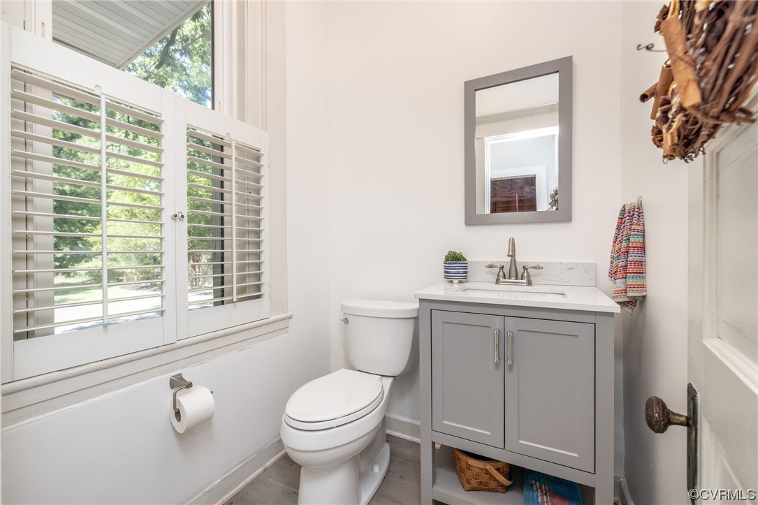 2731 Sherbourne Road Richmond, VA 23237 - Photo 17 of 45 a bathroom with a sink a toilet and a window