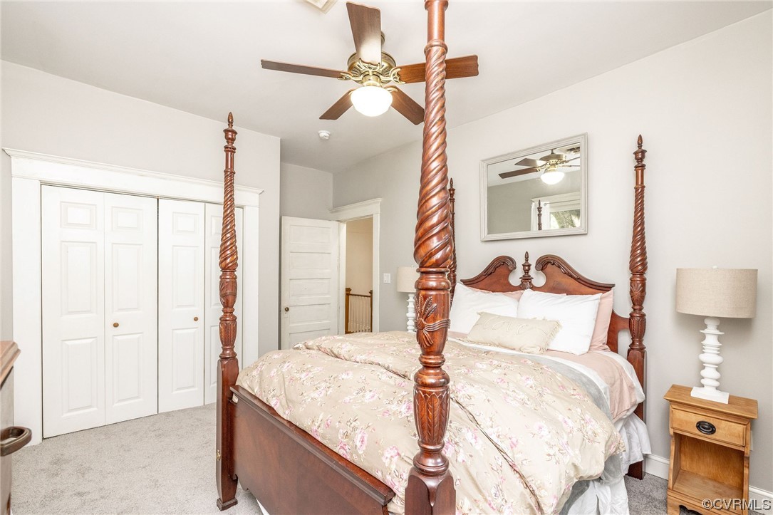 2731 Sherbourne Road Richmond, VA 23237 - Photo 30 of 45 a bedroom with a bed and a chandelier