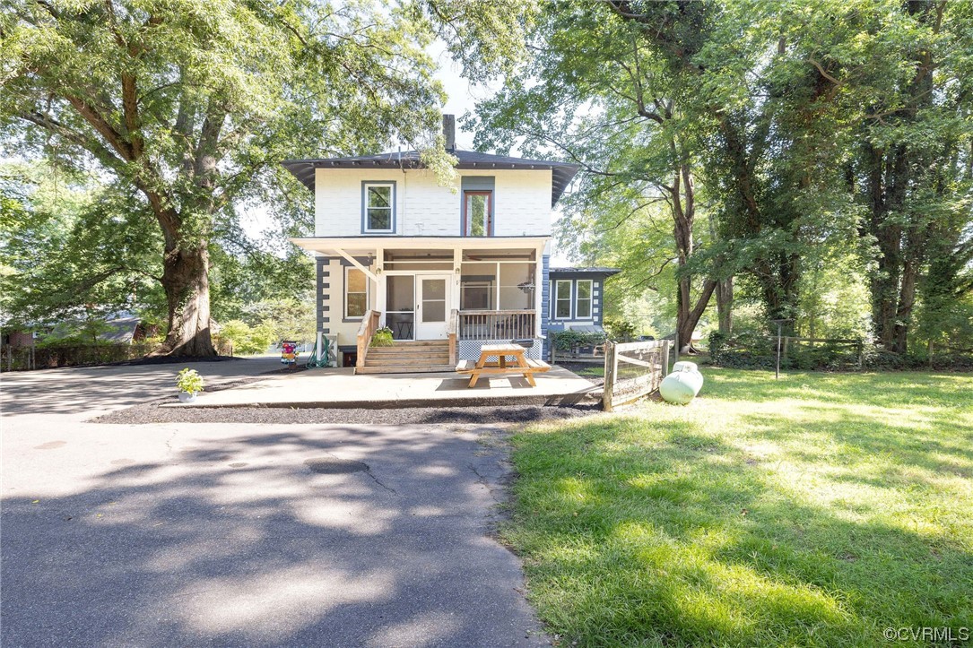 2731 Sherbourne Road Richmond, VA 23237 - Photo 39 of 45 a view of a house with a backyard and a tree