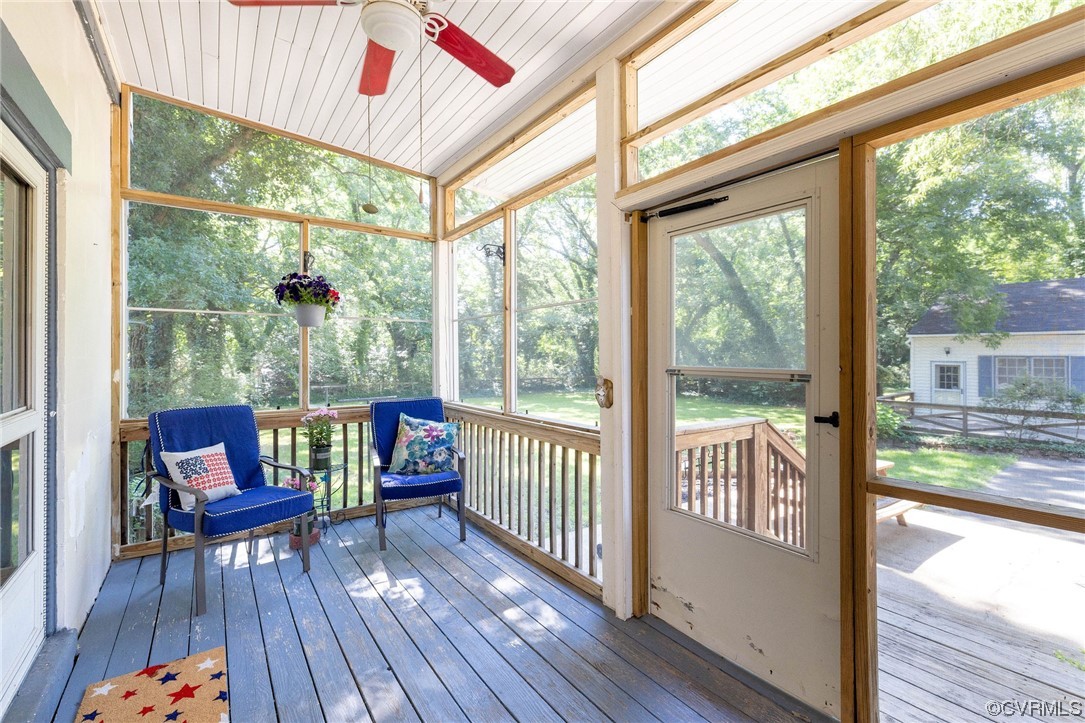 2731 Sherbourne Road Richmond, VA 23237 - Photo 42 of 45 a living room with large windows and wooden floor
