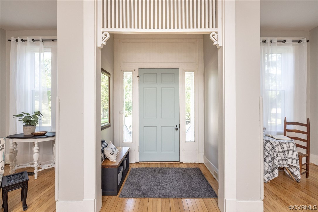 2731 Sherbourne Road Richmond, VA 23237 - Photo 6 of 45 hallway with wooden floor and a livingroom
