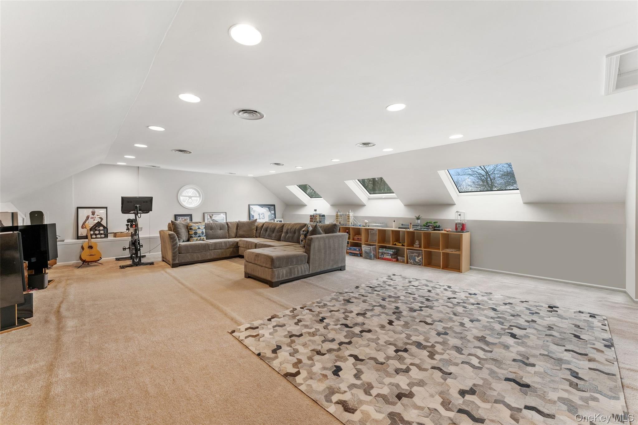 326 Heathcote Road Scarsdale, NY 10583 - Photo 27 of 40 Finished attic level boasts a beautifully finished and large open rec space with skylights.