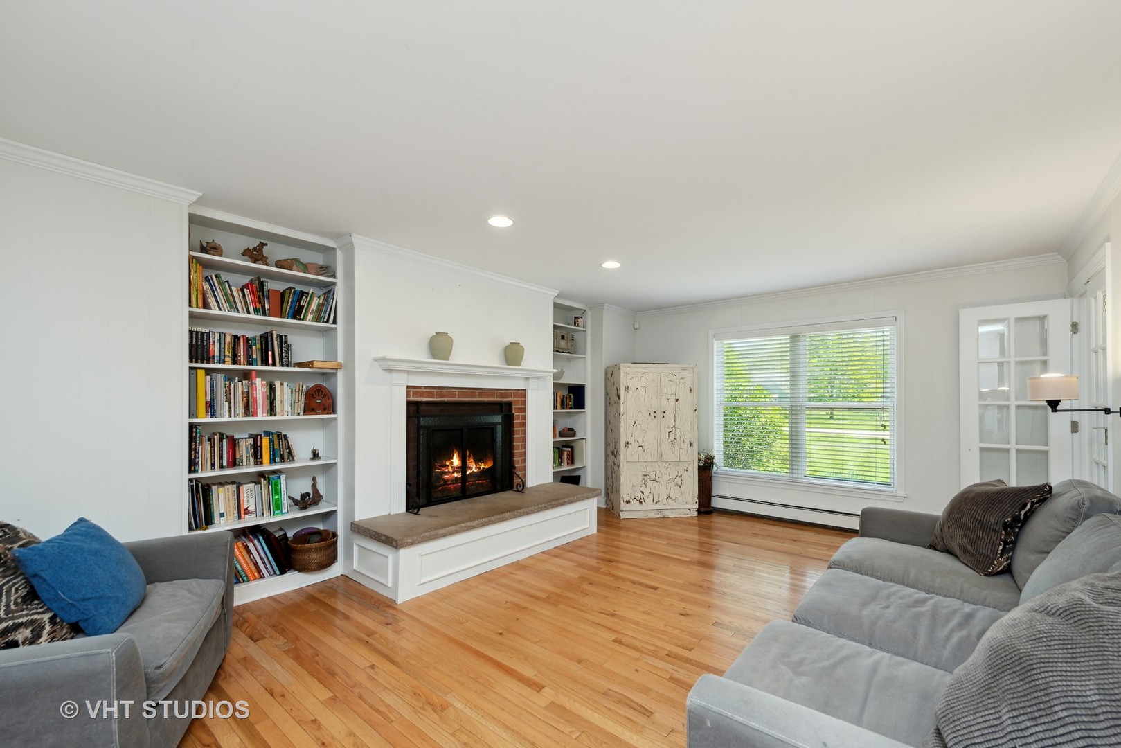 237 Valley Road Trout Valley, IL 60013 - Photo 12 of 48 a living room with furniture window and a fireplace