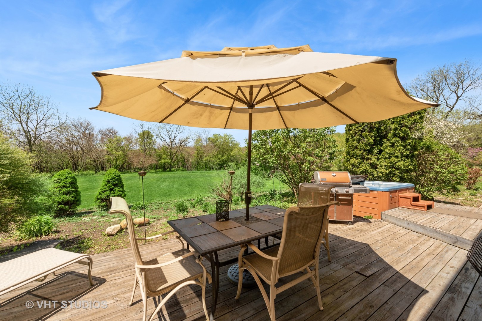 237 Valley Road Trout Valley, IL 60013 - Photo 24 of 48 a view of a patio with table and chairs under an umbrella