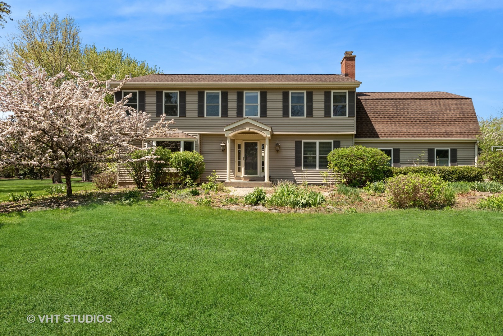 237 Valley Road Trout Valley, IL 60013 - Photo 3 of 48 a front view of a house with a garden
