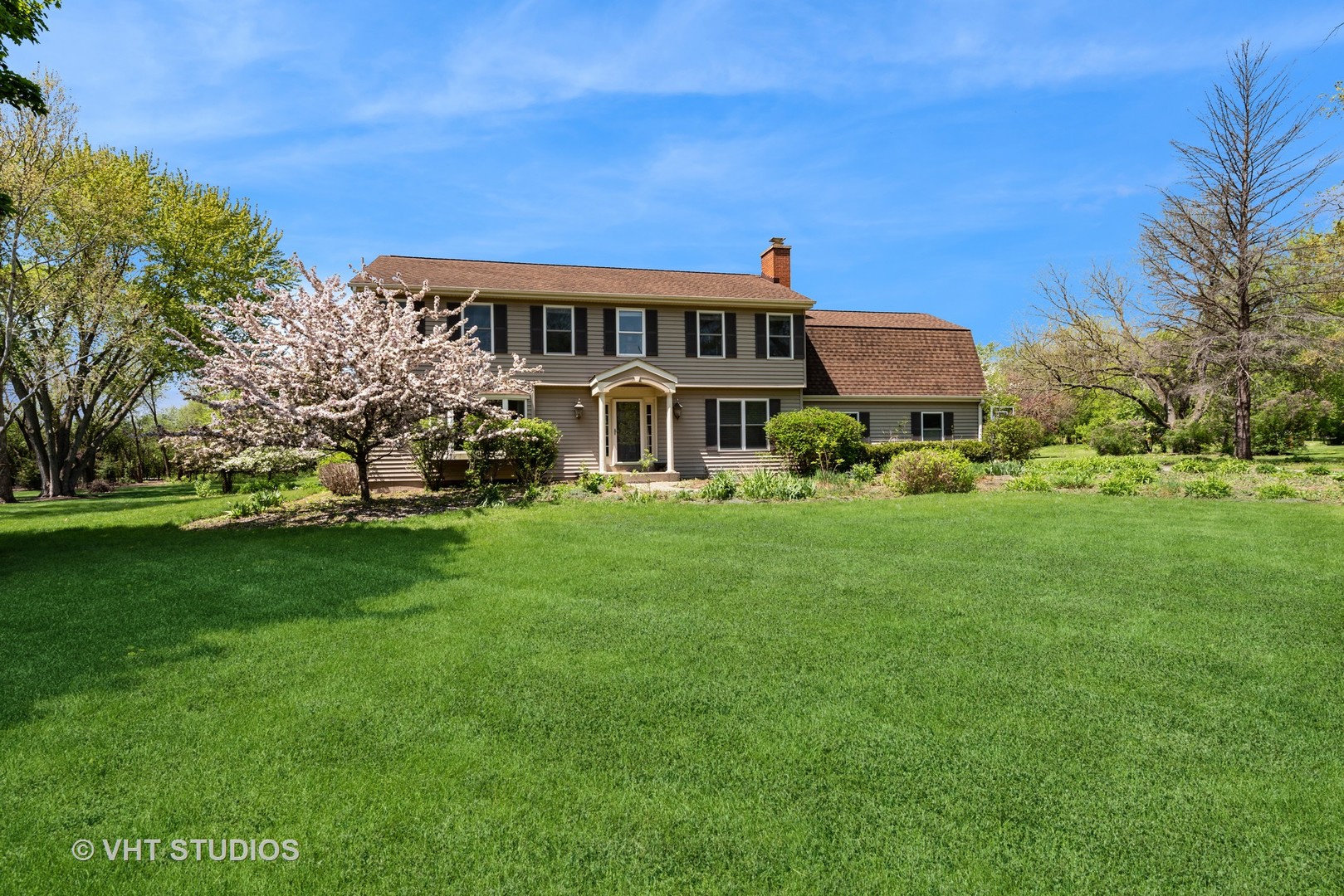 237 Valley Road Trout Valley, IL 60013 - Photo 4 of 48 a front view of a house with a garden