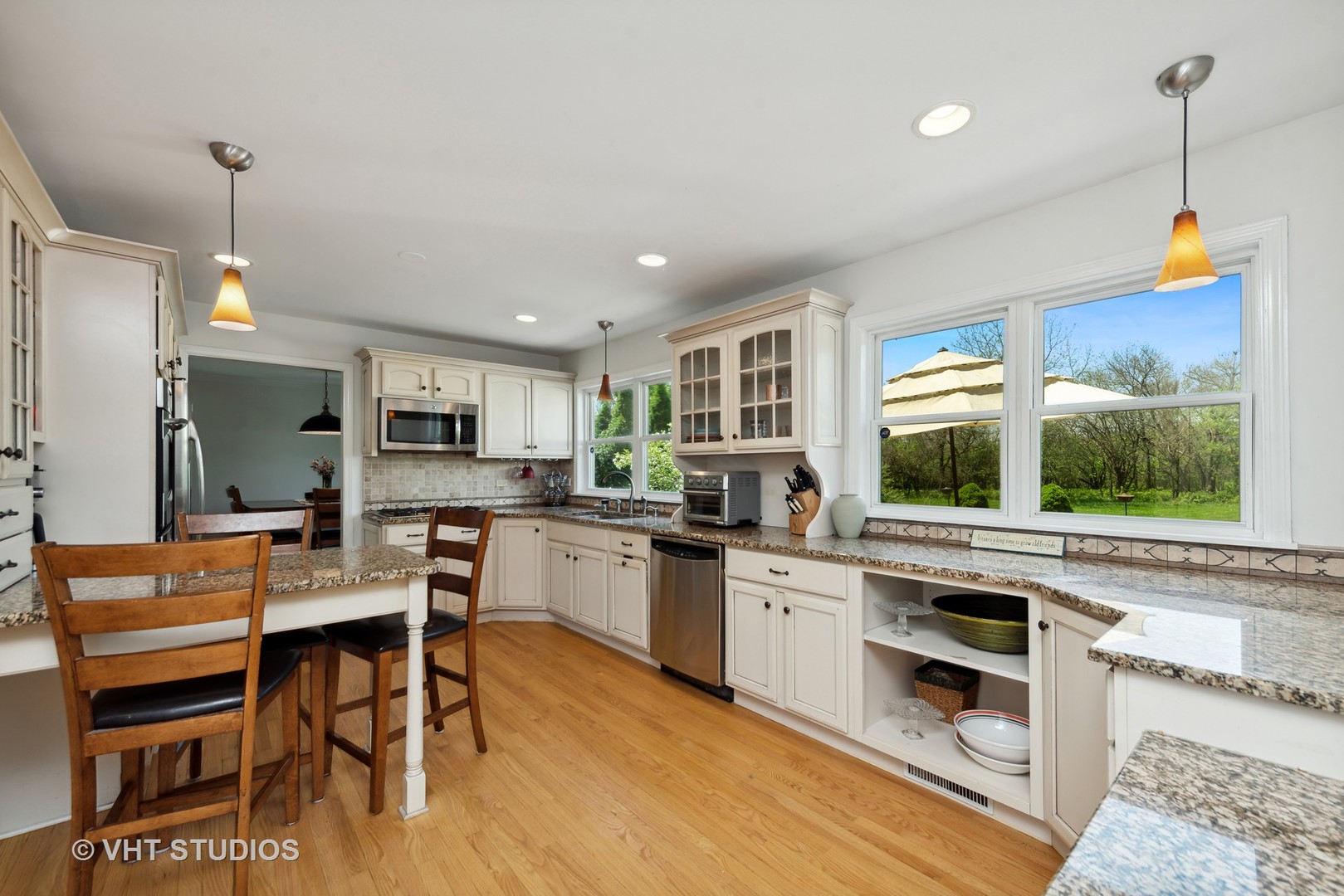 237 Valley Road Trout Valley, IL 60013 - Photo 5 of 48 a room with stainless steel appliances kitchen island granite countertop a stove and a wooden floor