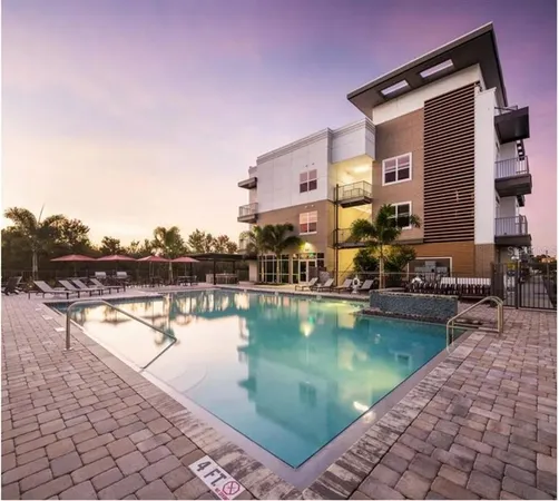 a view of a swimming pool with a lounge chairs