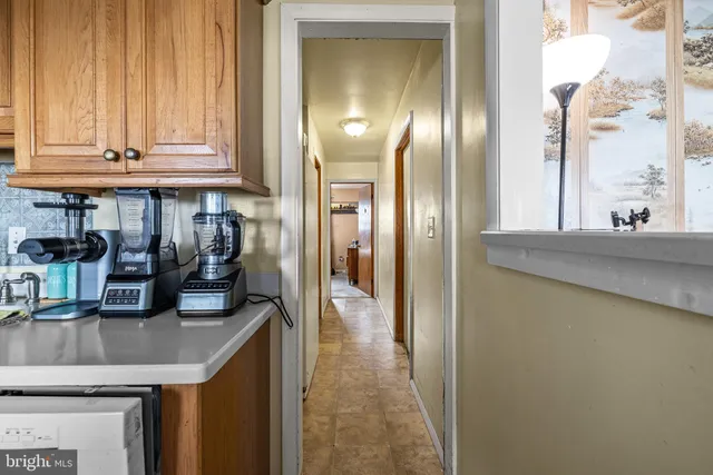 a kitchen with stainless steel appliances granite countertop a sink and a refrigerator
