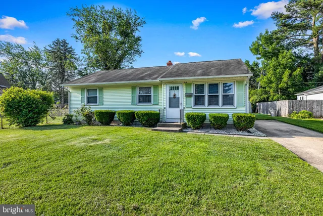 front view of a house with a garden
