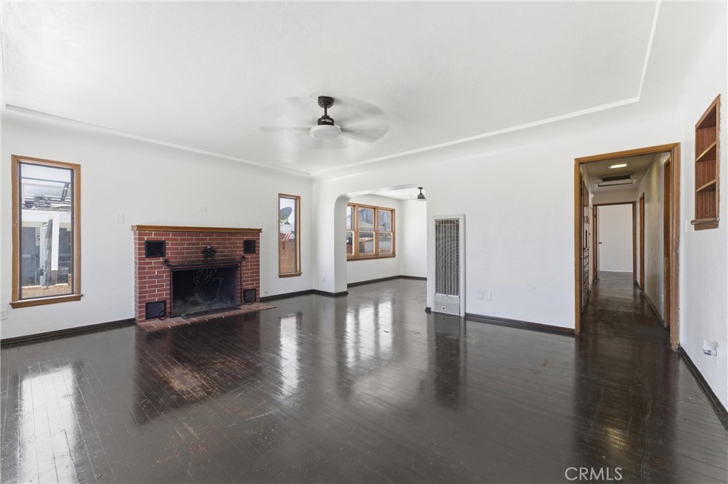 44509 Date Lancaster, CA 93534 - Photo 4 of 20 a view of an empty room with window and fire place