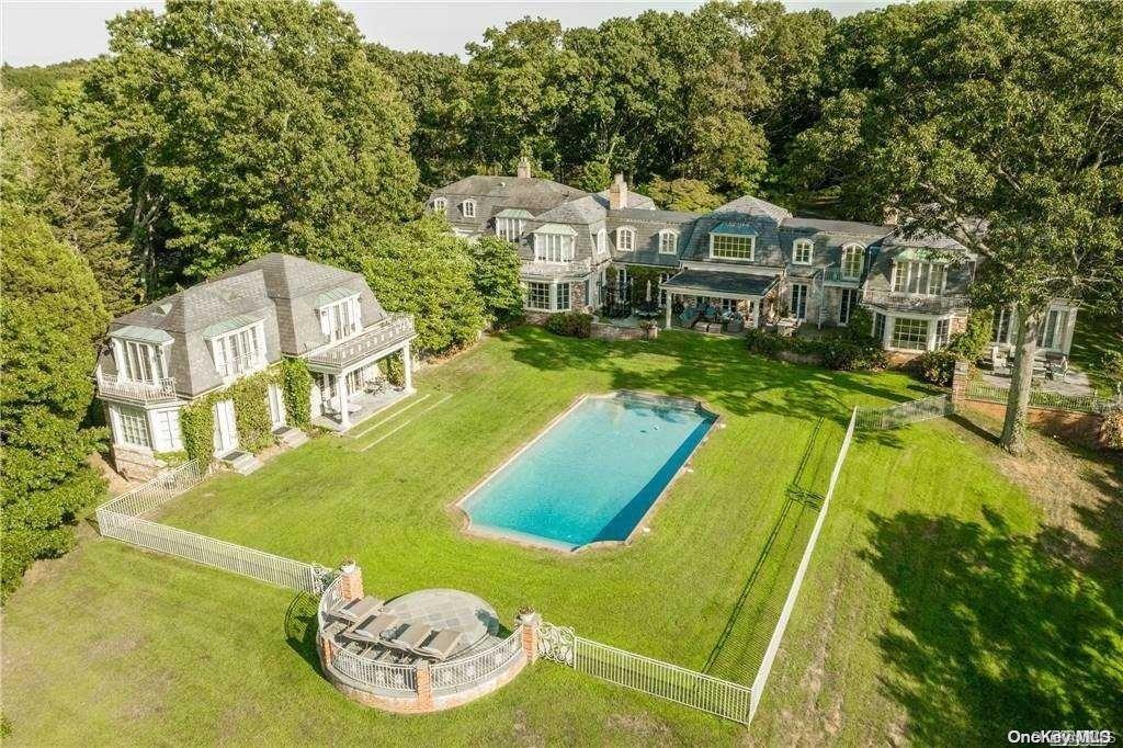 214 Cleft Road Mill Neck, NY 11765 - Photo 2 of 36 a view of a house with a big yard and large trees