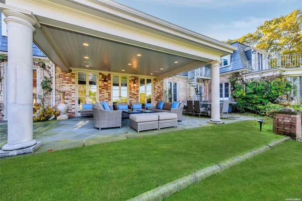 a view of a porch with chairs and a patio