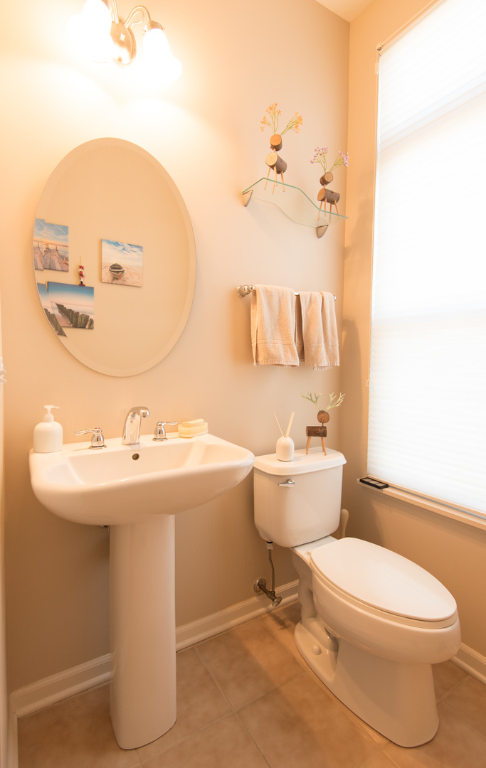 263 Aspen Pointe Road Vernon Hills, IL 60061 - Photo 8 of 16 a bathroom with a sink mirror and toilet