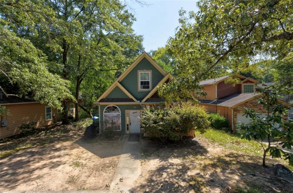 166 Nathan Road Southwest Atlanta, GA 30331 - Photo 1 of 1 a front view of a house with a yard