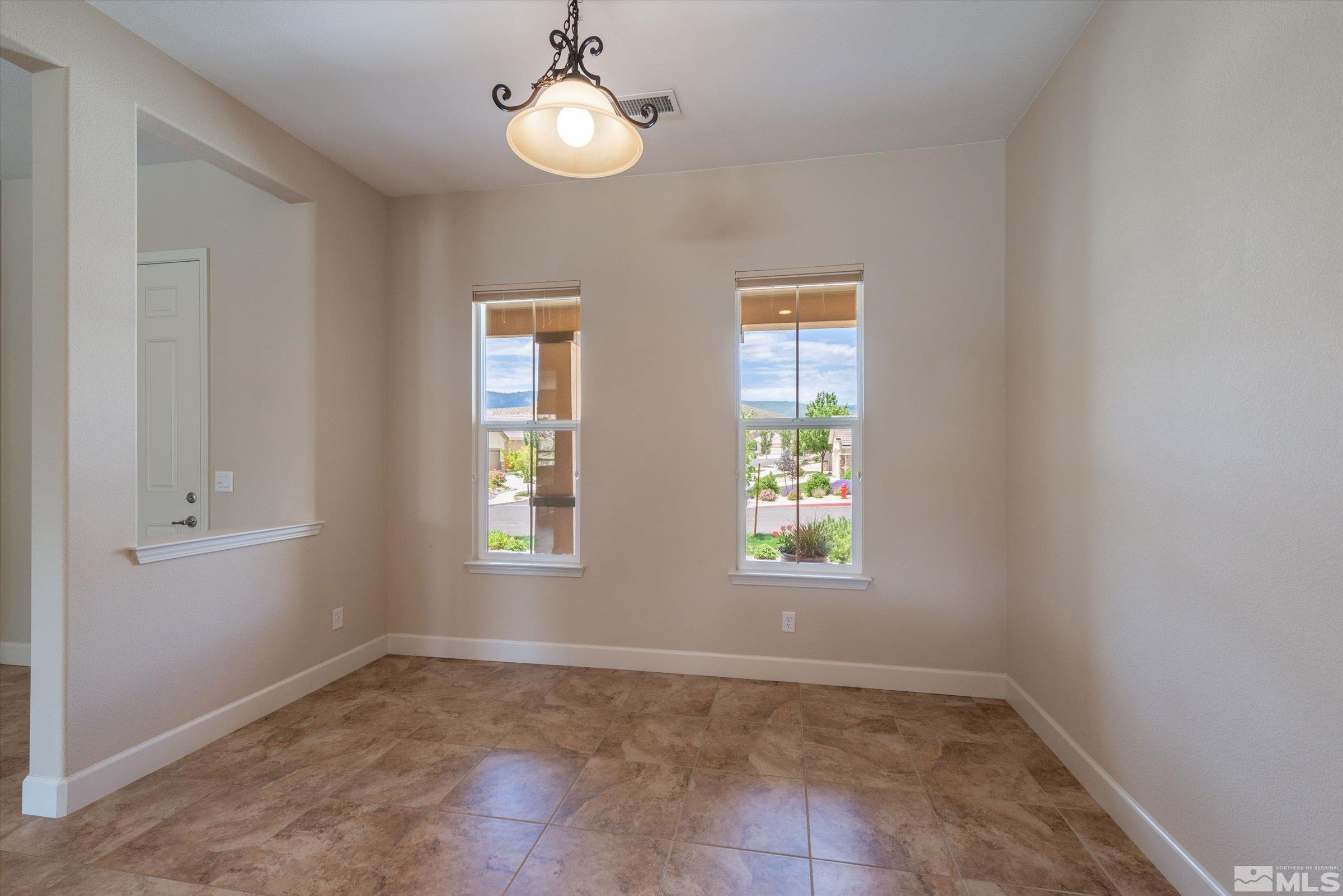 1310 Winterchase Way Reno, NV 89523 - Photo 13 of 38 an empty room with windows and fan