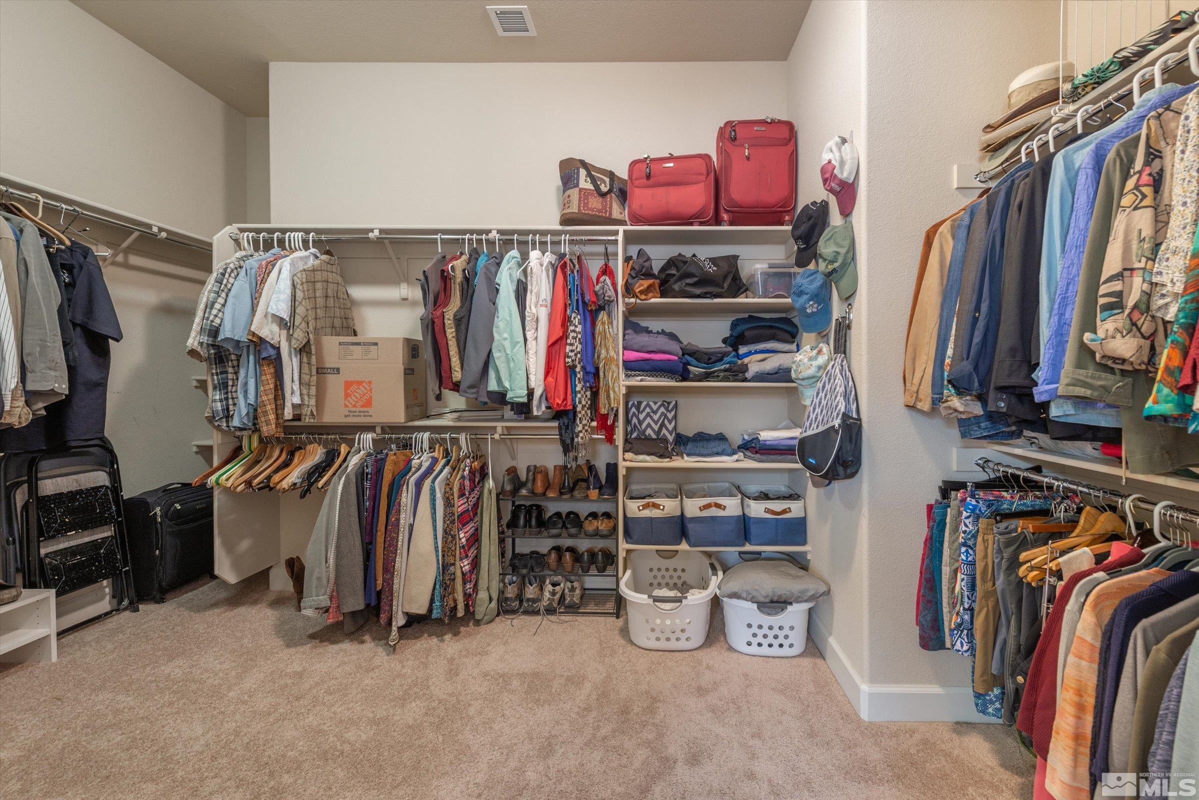1310 Winterchase Way Reno, NV 89523 - Photo 24 of 38 a view of walk in closet with clothes and shoes