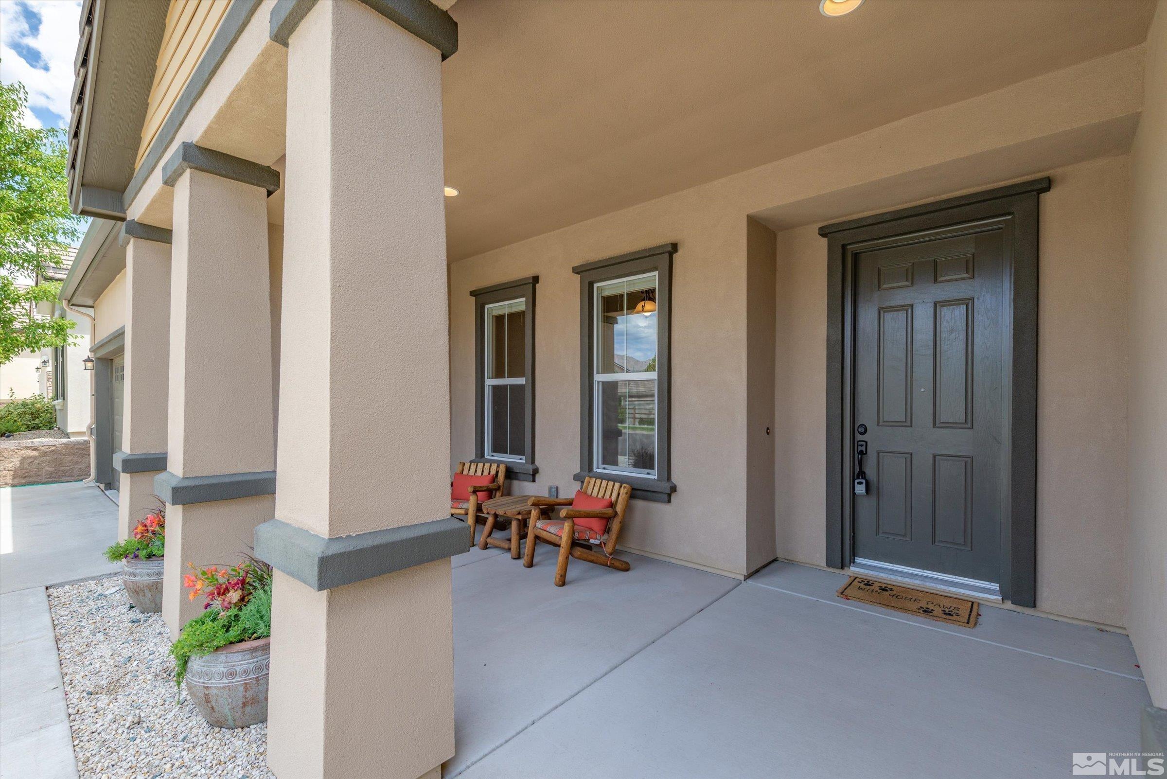 1310 Winterchase Way Reno, NV 89523 - Photo 4 of 38 a building outdoor space with patio furniture and potted plants