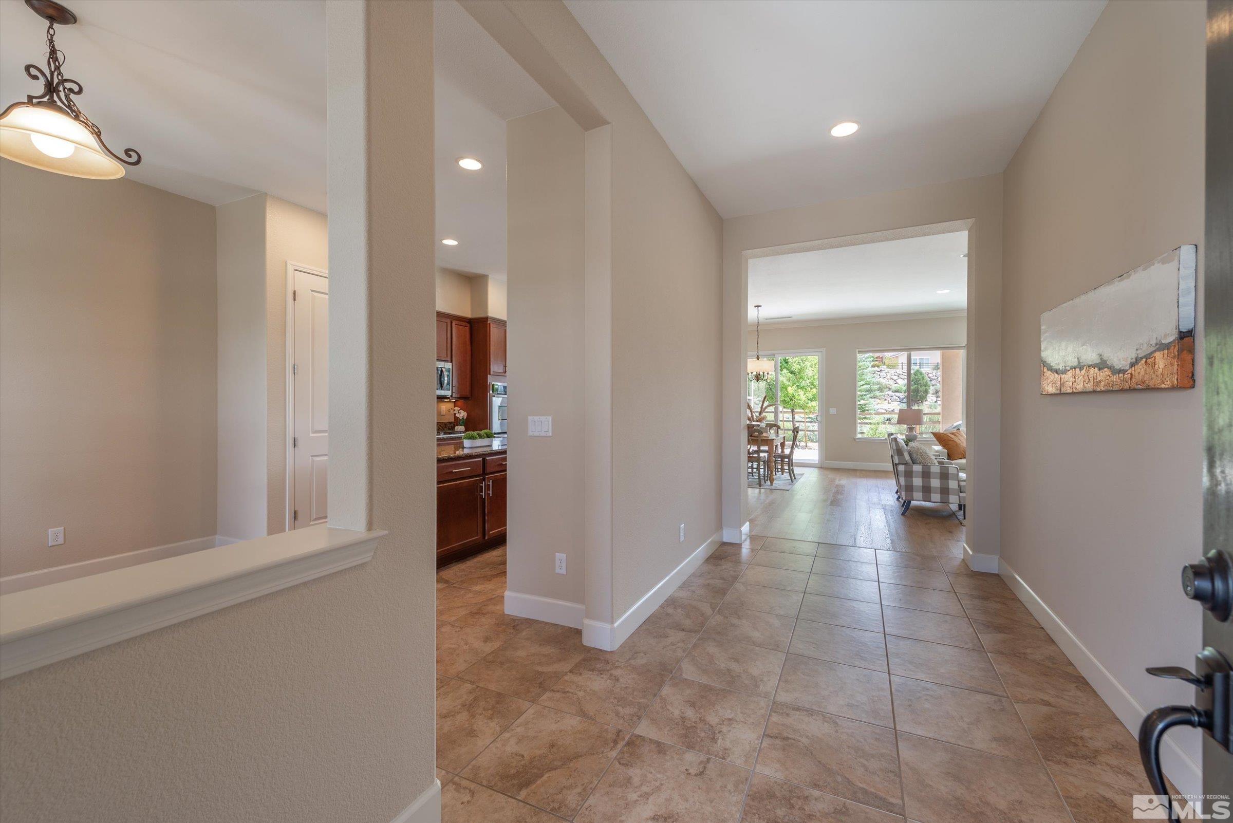 1310 Winterchase Way Reno, NV 89523 - Photo 6 of 38 a view of a hallway with wooden floor and a bathroom