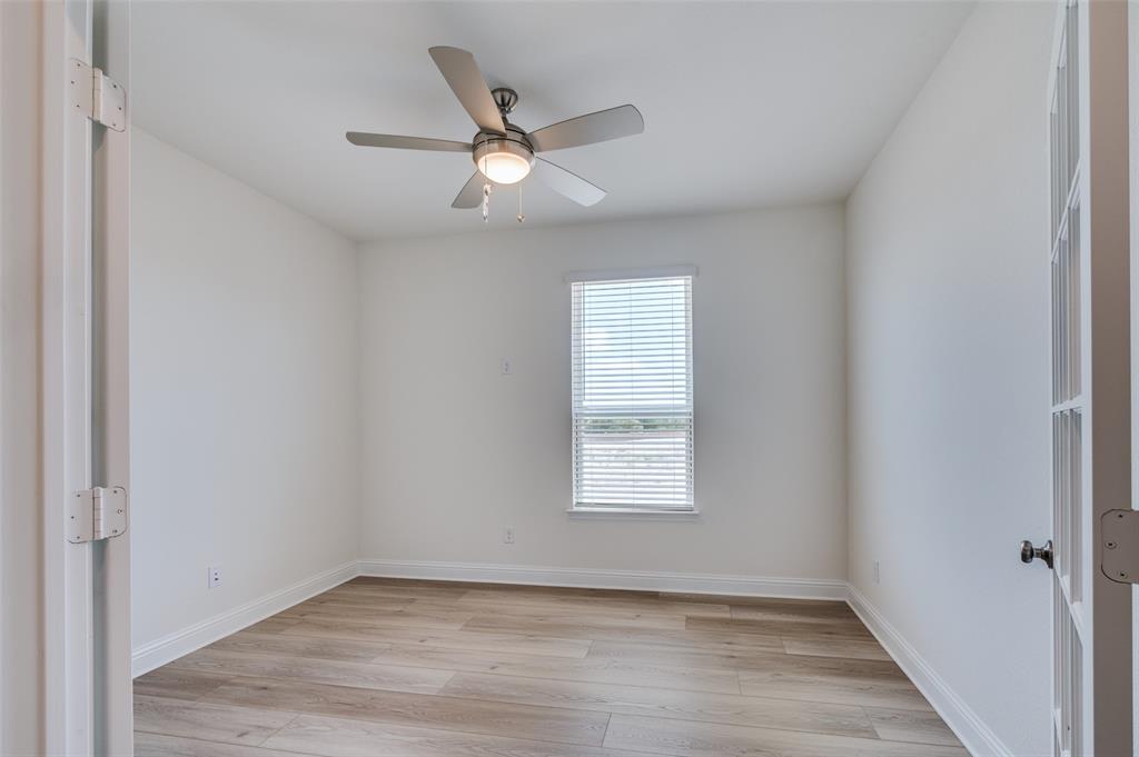 345 Fallbrook Drive Aledo, TX 76008 - Photo 20 of 32 Spare room featuring light wood-style floors and a ceiling fan