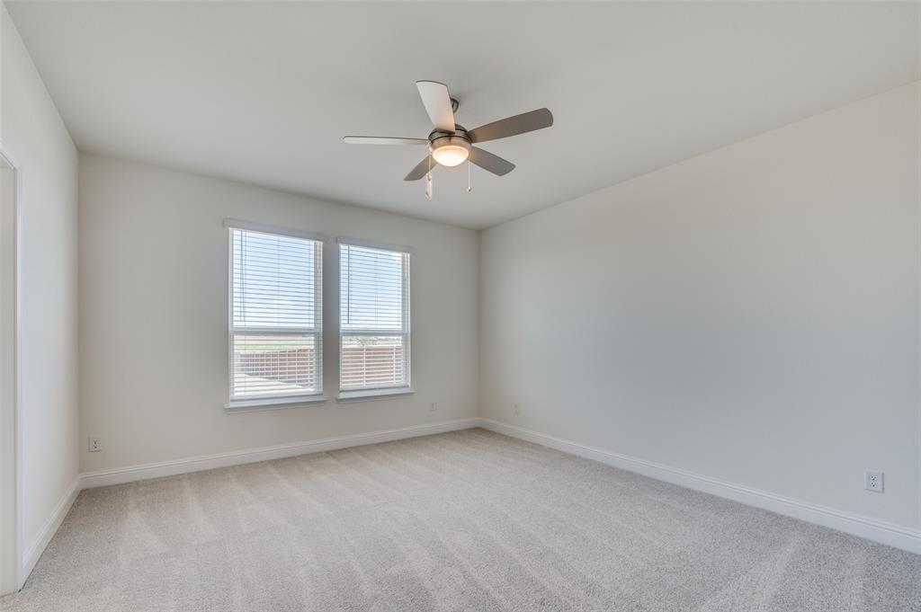 345 Fallbrook Drive Aledo, TX 76008 - Photo 10 of 32 Unfurnished room with light colored carpet and a ceiling fan